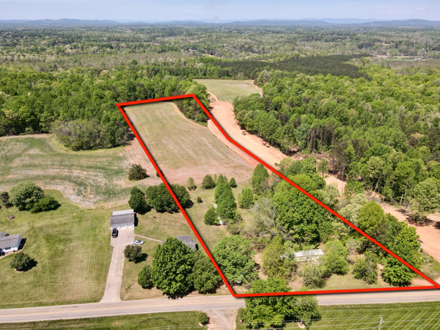 JUDICIAL SALE - 6.96 +/- Beautiful Acres with Outbuildings and Manufactured Home
