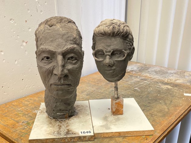 Two human head sculptures